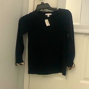 Black Burberry long sleeve t shirt with tag. Size 10 in girls (kids).